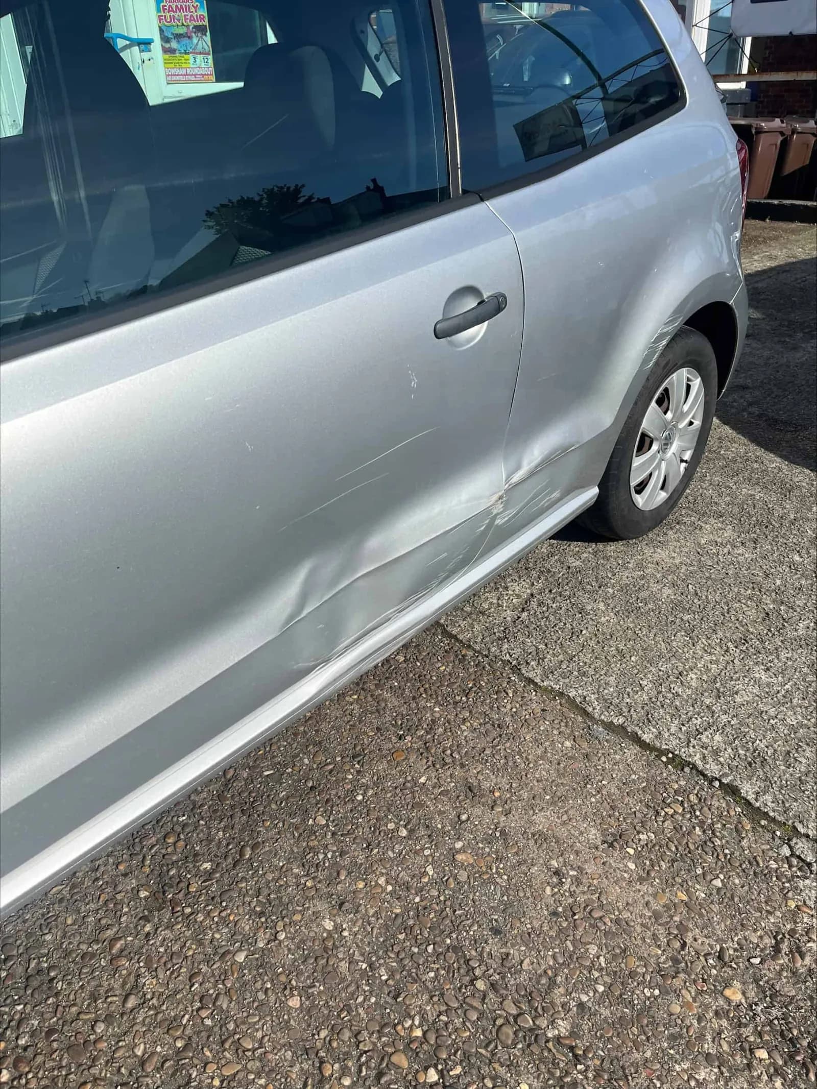 an image of a damaged volkswagen polo