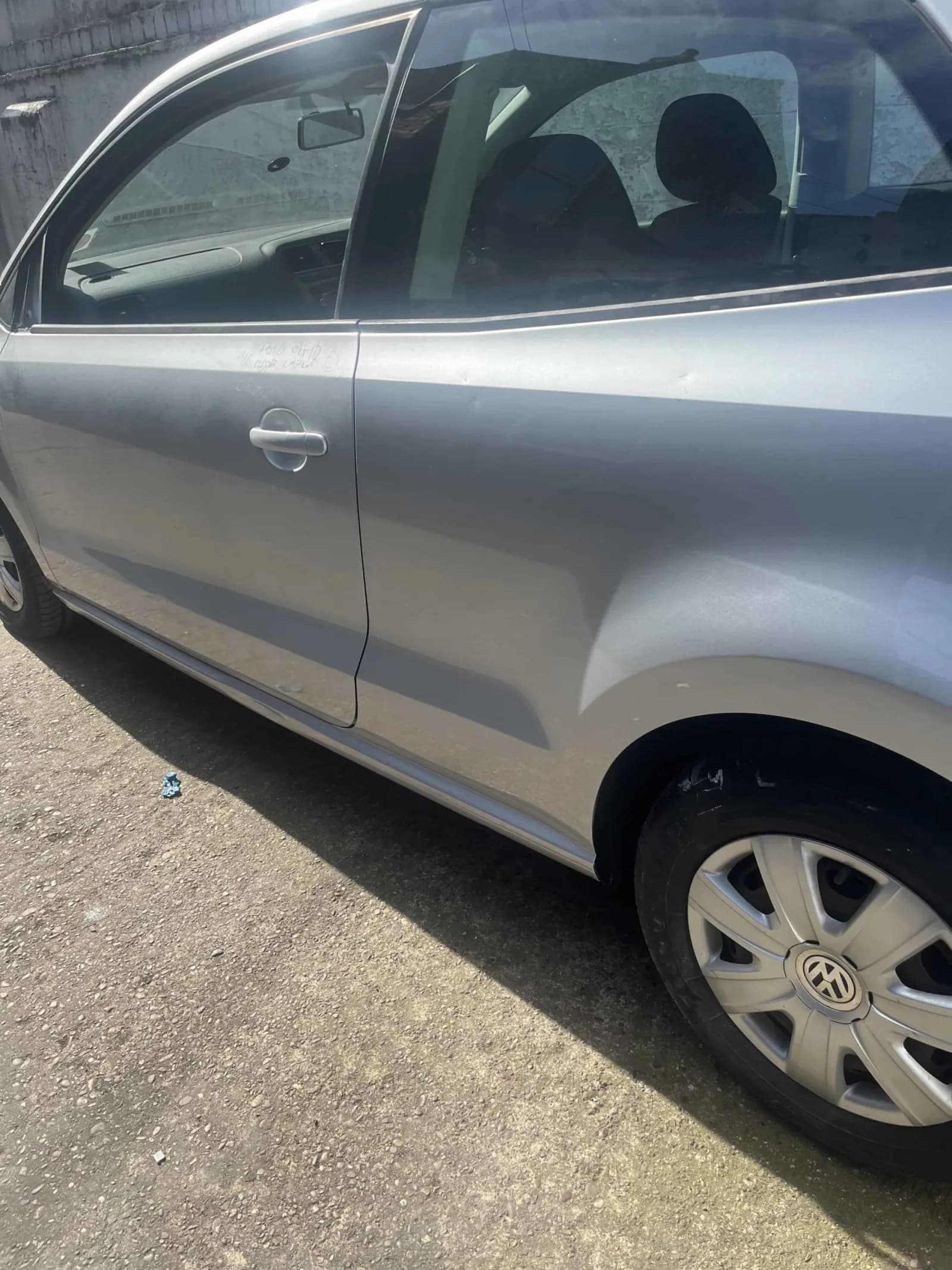 Silver Volkswagen Polo side after the door and rear quarter repair