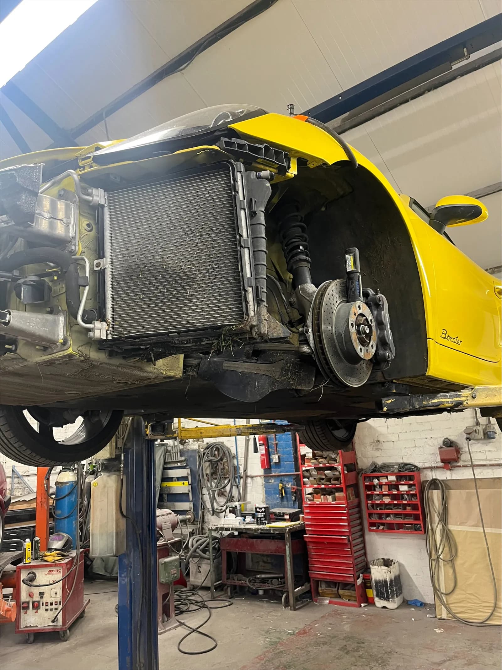images of a porsche which has had a repair