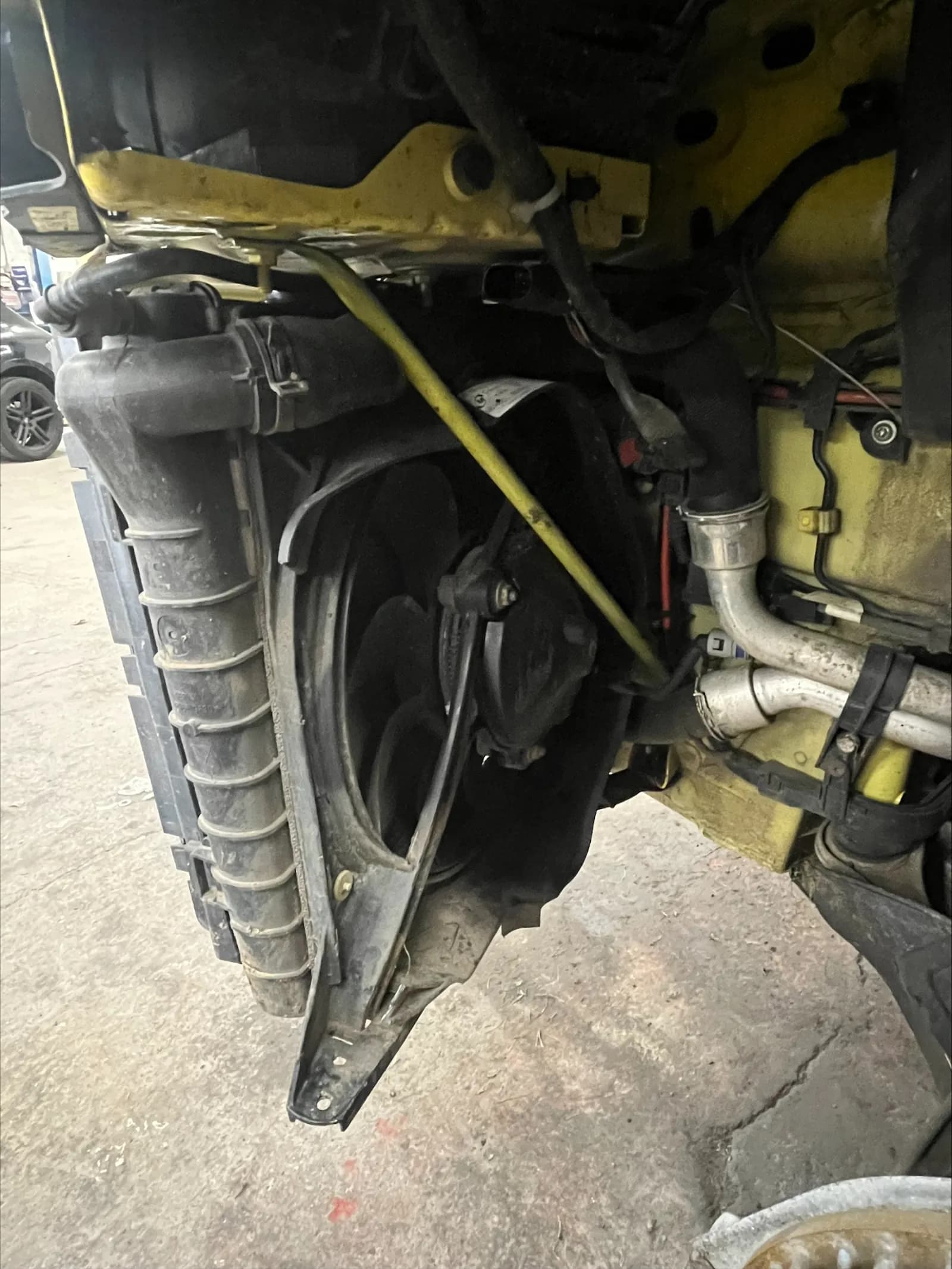 Damaged radiator and front structure behind the Porsche Boxster bumper