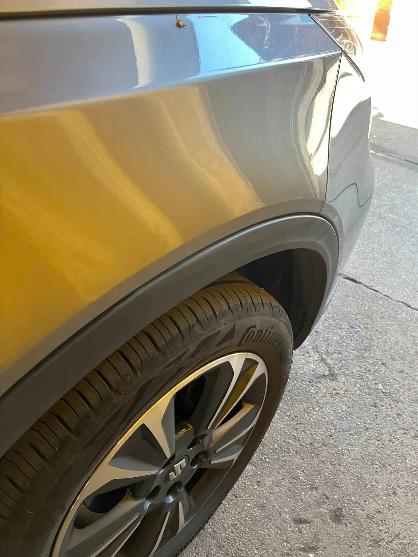 Suzuki Vitara front wing and wheel arch photographed outdoors