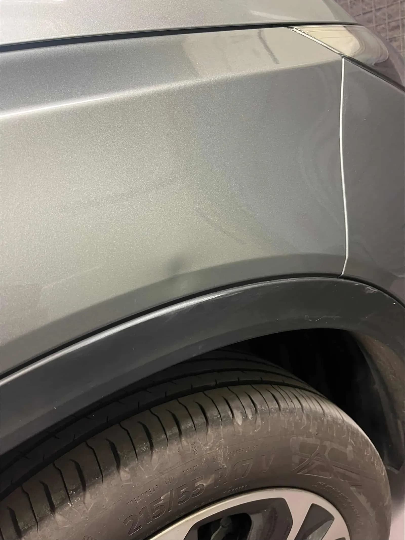 Close-up of the repaired Suzuki Vitara front wing and wheel arch